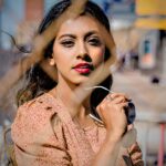Dog grooming Portrait of a fashionable woman outdoors holding sunglasses.